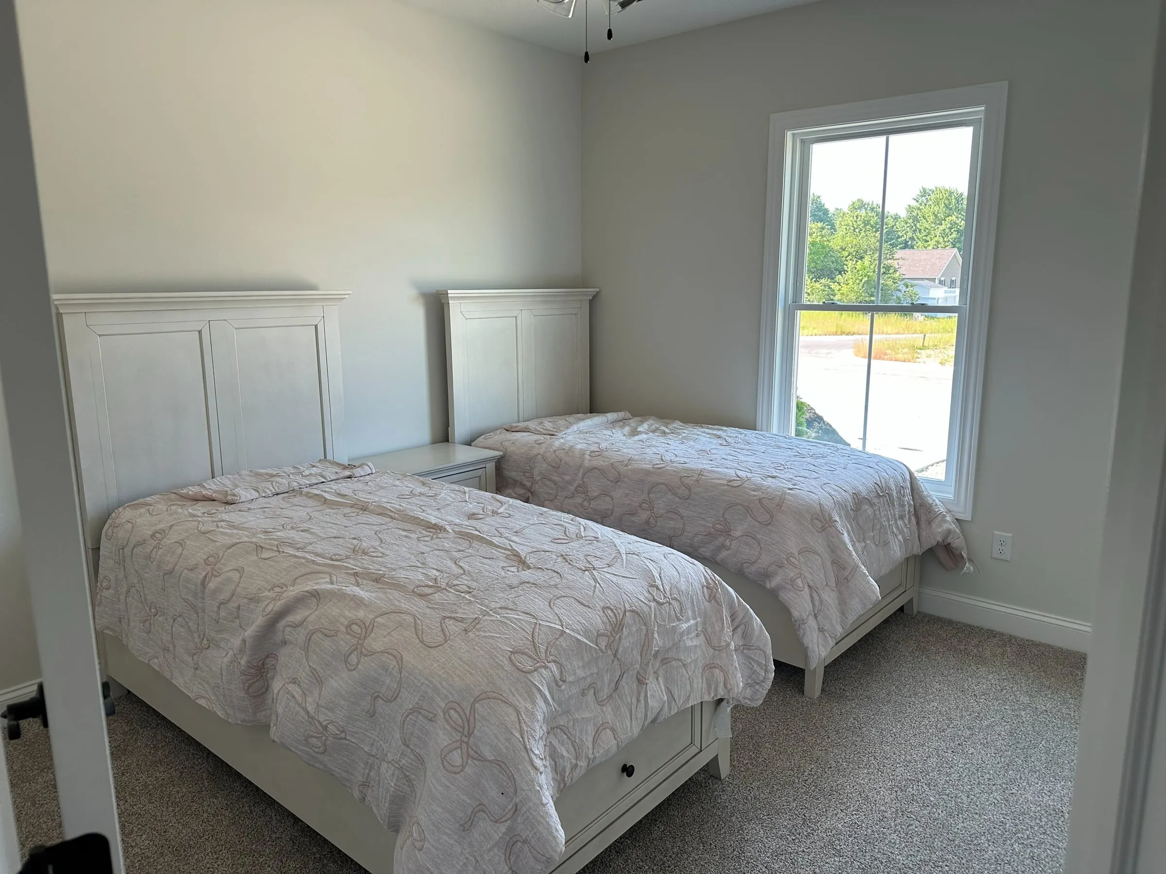 Model home bedroom with two twin beds