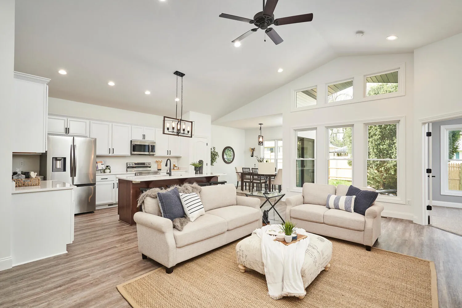 Great room with a floor-to-ceiling stone fireplace in a Hahn home
