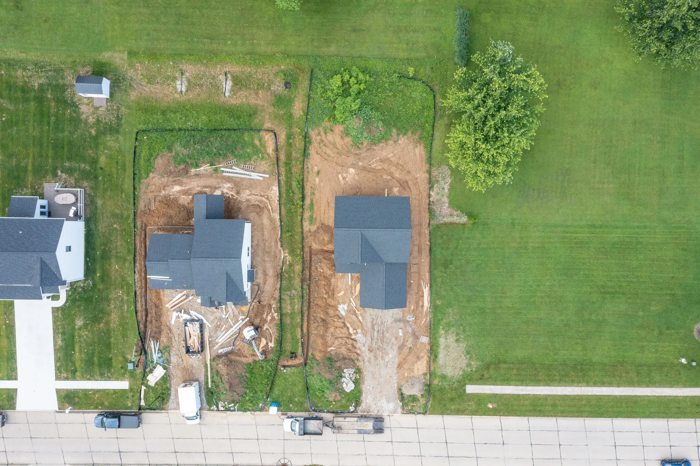Aerial view of two homes under construction