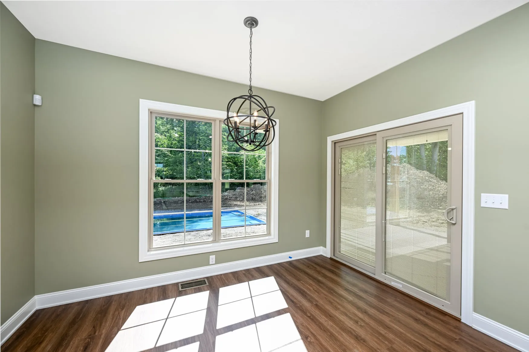 Dining area with sliding doors to the pool