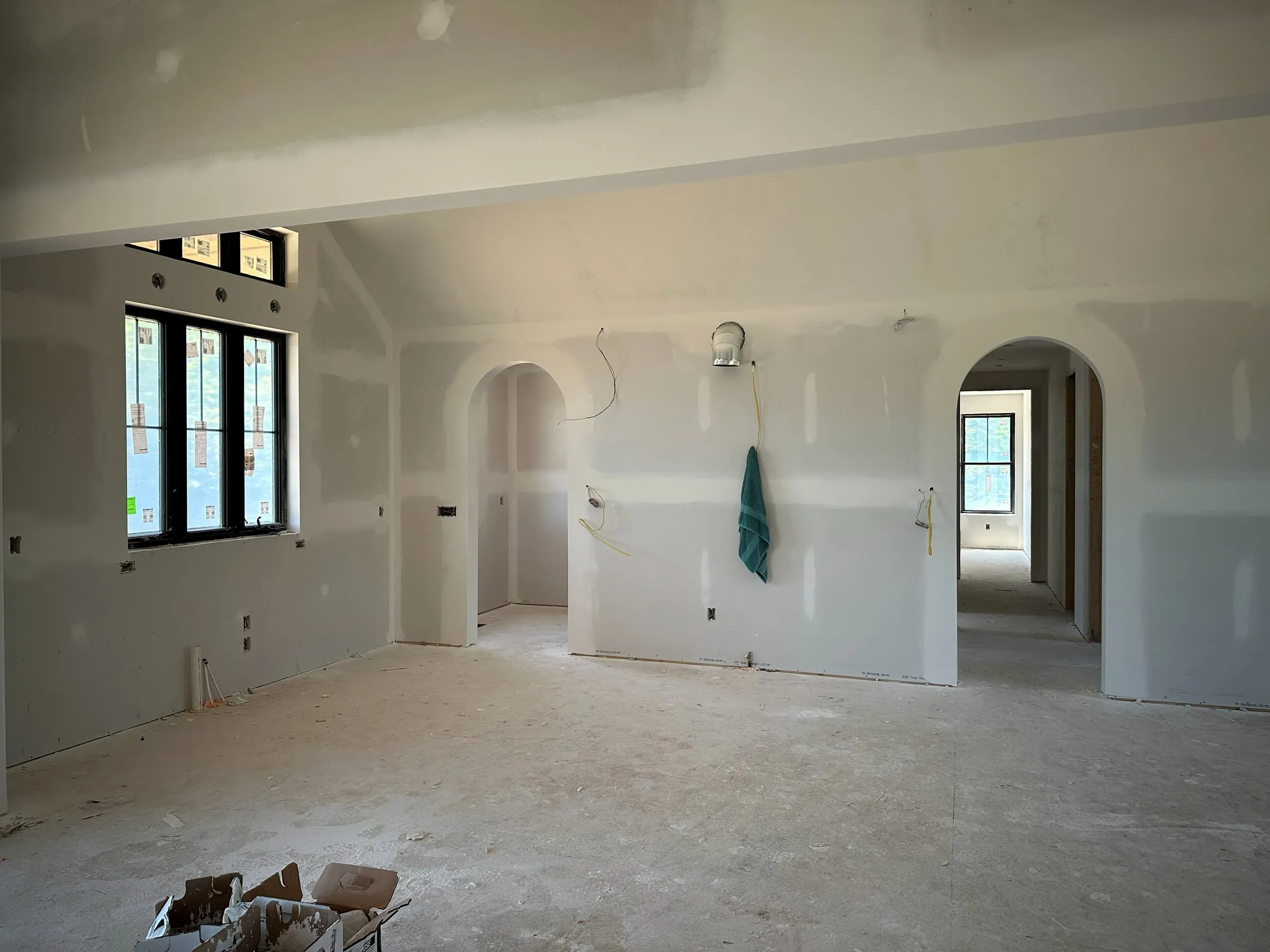 Drywall hung in a vaulted great room before finishes