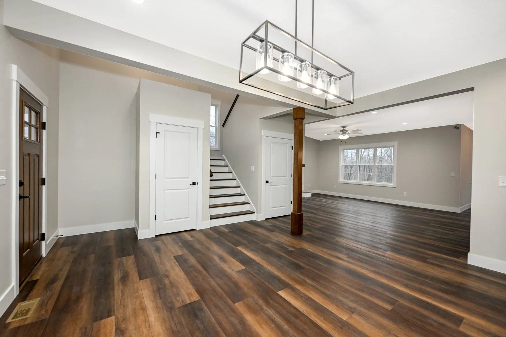 Entry and dining area with wide-plank flooring
