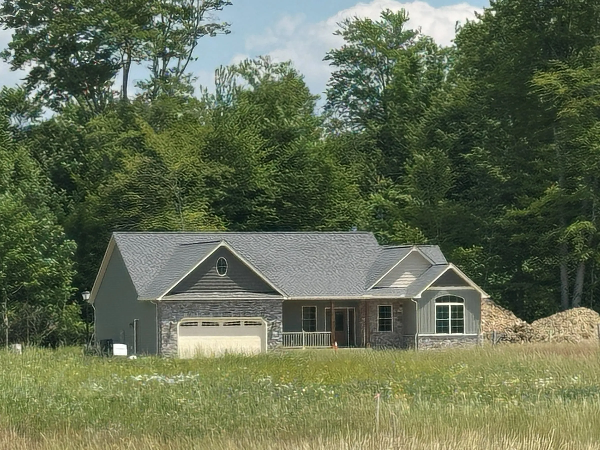 The model home seen across the meadow