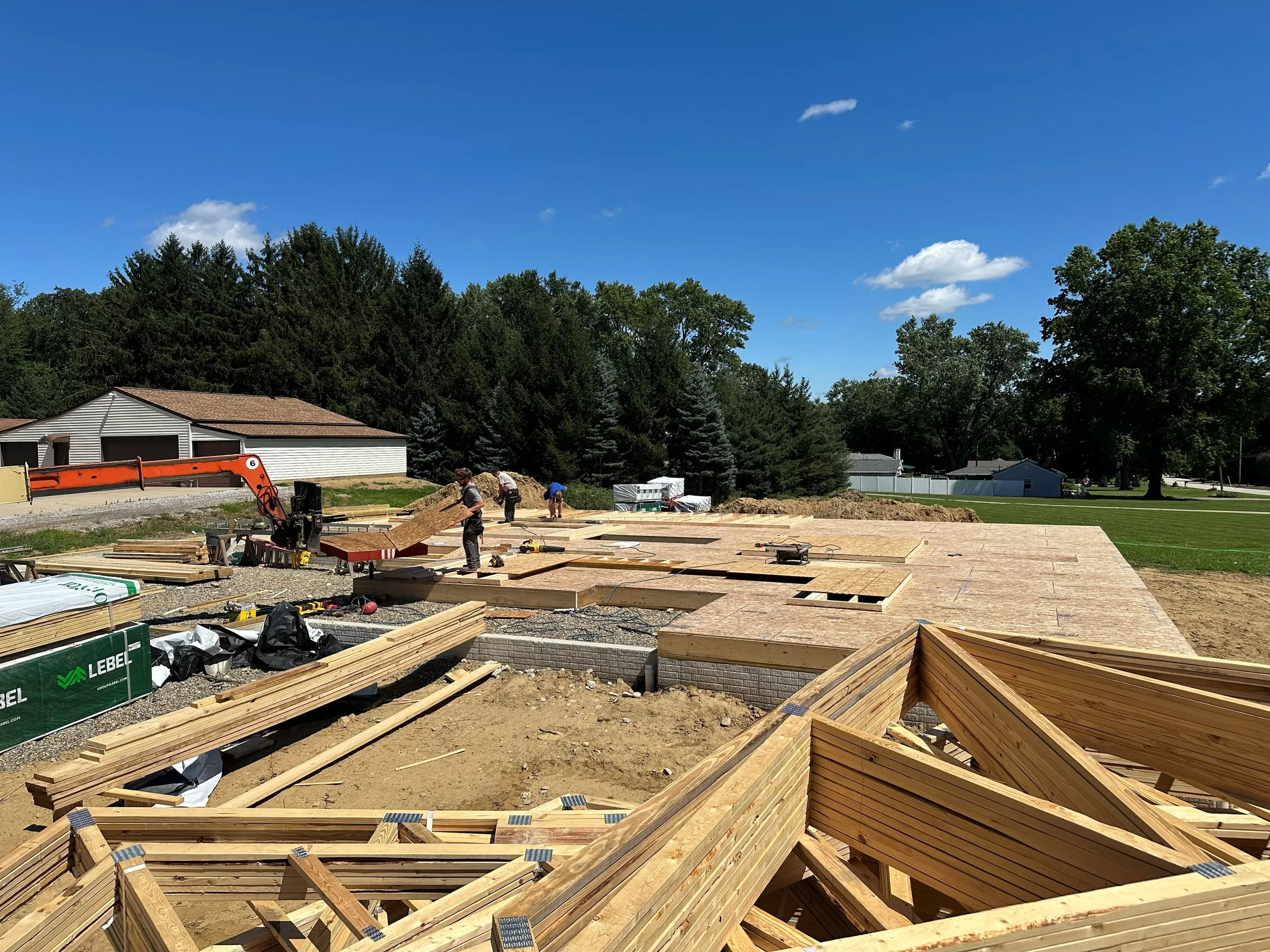 Floor system framing going up over a new foundation
