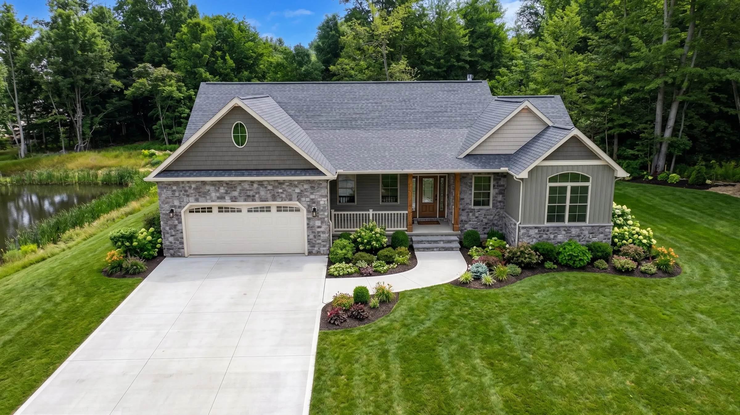 Stone-and-siding ranch home with finished landscaping
