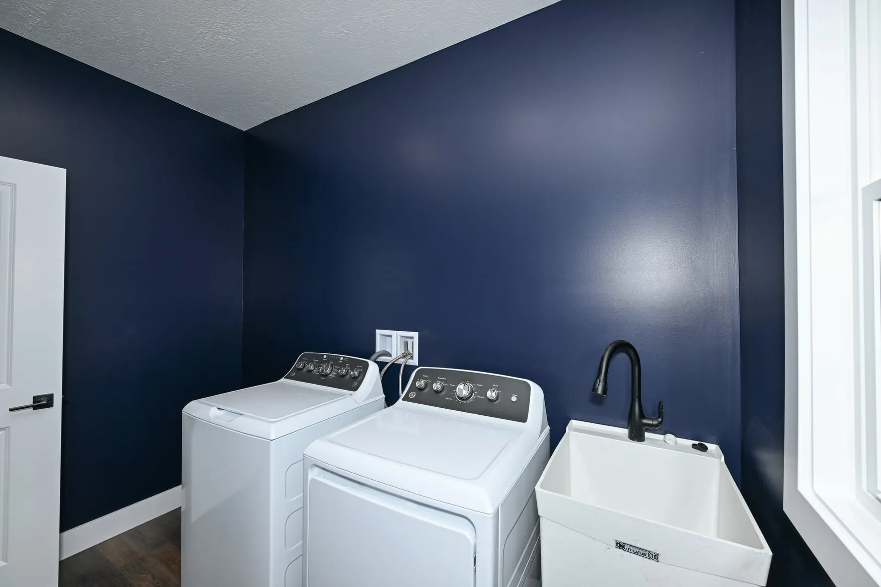Laundry room with a utility sink