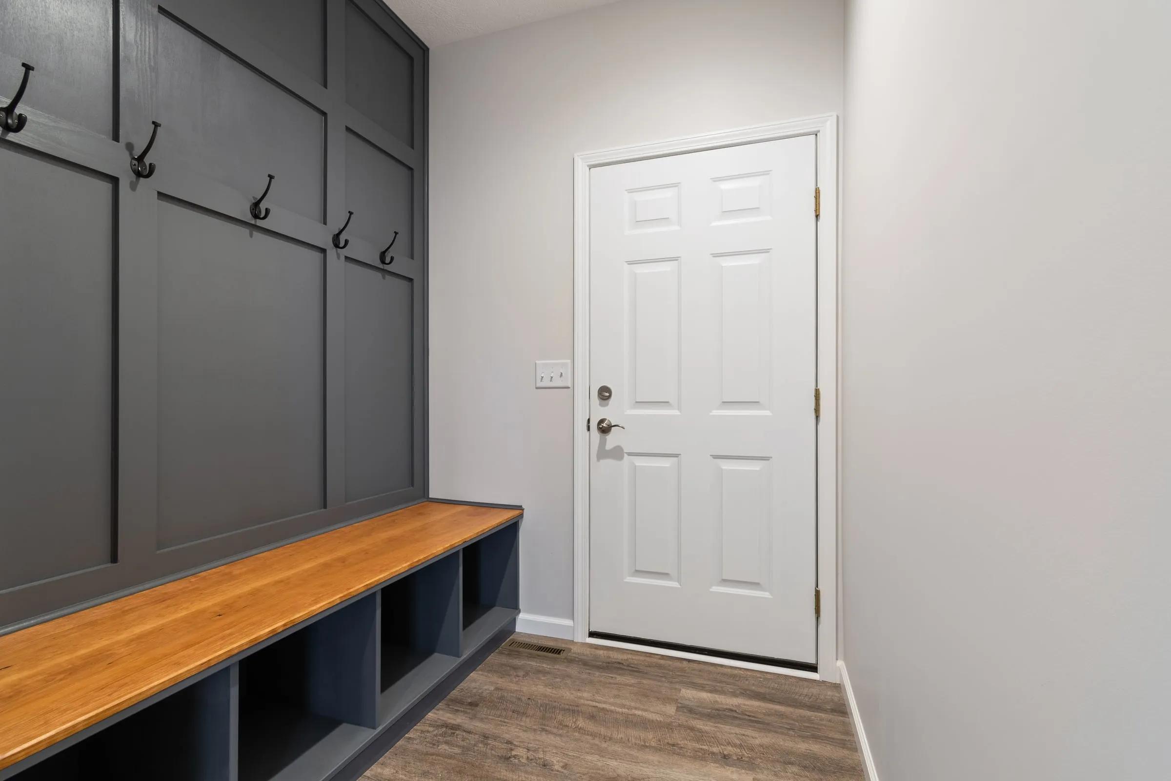 Mudroom with built-in bench and hooks