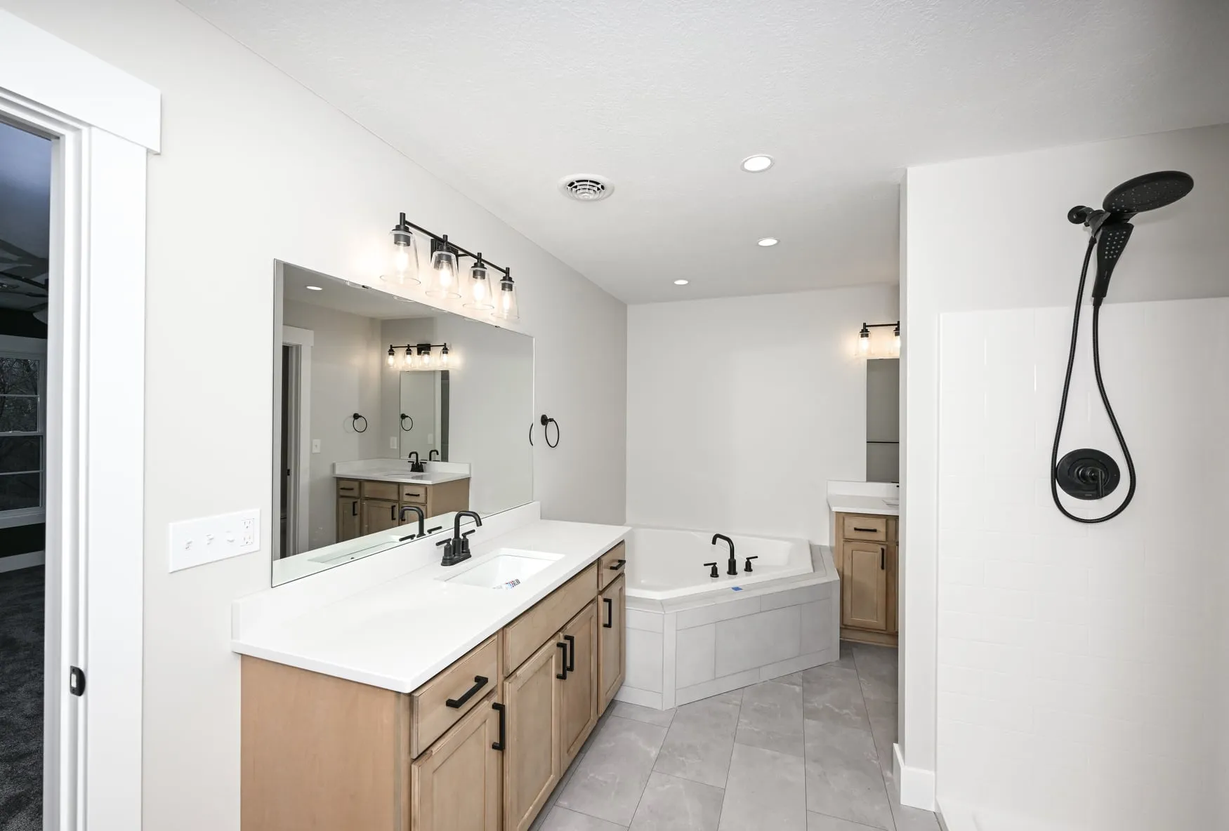 Owner's bath with a soaking tub and double vanity