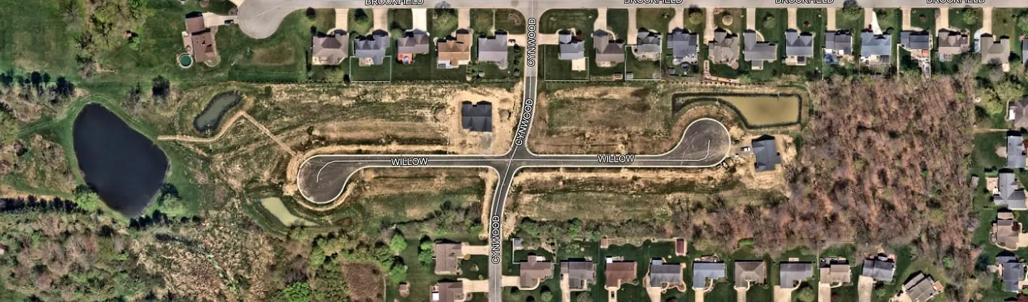 Satellite view of Willow Run at Norton: Willow Way and Cynwood Drive, the community ponds, the large existing pond to the west, and the woods to the east